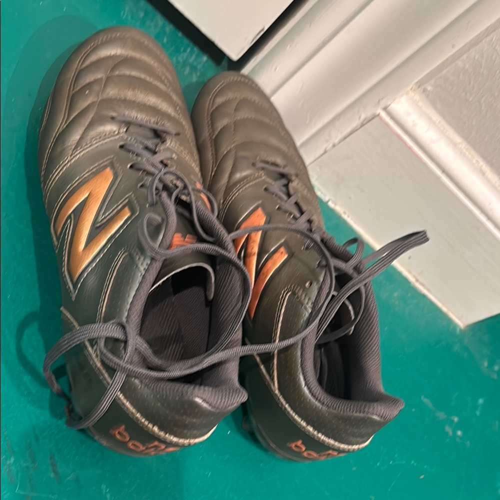 New Balance Kids Gray and Orange soccer cleats